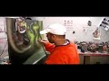 Steve Nunez airbrushes a \"Warcraft Orc\"