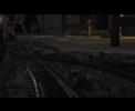 Fahrt mit dem Videowagen mit Filmkamera über die Gartenbahn