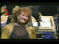 from 'v45 britain at war: a nation remembers', broadcast live on 10th july 2005. petula, a child star during world war ii, sings this song made popular during the war by vera lynn. on the right of pet there's a photo of her at the time.