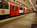 Central Line tube train arrives at Queensway station
