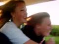 Riding a golf cart.