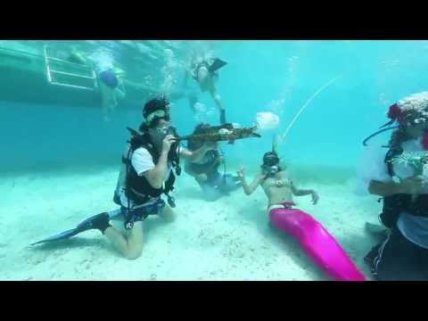 Underwater Music Festival Stars Keys Coral Reef and Costumed Divers