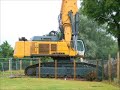 A LIEBHERR 984 AT WORK TEARING DOWN OLD BOLTON COURT FLATS