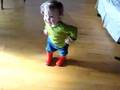 Baby tap dances in her new wellington boots