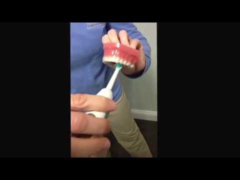 how to use a sonic toothbrush