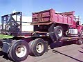 Mack SuperLiner hauling Brockway Dump truck