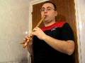 Ahmet Akarsu playing kaval at home