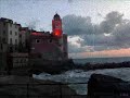 passeggiata per tellaro,in liguria,al tramonto dopo la pioggia..sottofondo at the gates - into the dead sky