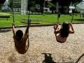 Andrew & Britney on the swings at Father Mac's