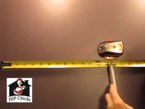 HIP Chicks shows how to hang a heavy mirror on the wall using laser level and wall anchors