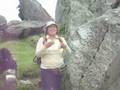 Guide talking about stone work at quarry in Machu Picchu.