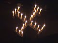 york minster - the advent procession 2007.  starting in complete darkness, a single candle is lit, and passed to the choir.  they move around the space, singing antiphons, as gradually the light spreads to every person in the building.