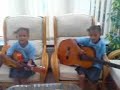 The twins ( Playing the Guitar and singing)
