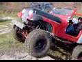 Jeep CJ7 climbing a Rock Ledge in 2wd