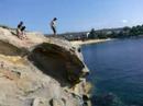 matt, edan, anton tackle 40 foot low tide camp cove. tom rabin behind the lense documenting the stupid skit.