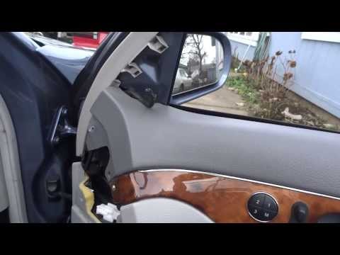 Removing a door panel on Mercedes Benz W211 and replacing power seat control.