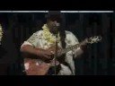 willie k. performs his song mountain of gold at the obama ohana  rally in support of barack obama in lihu'e, kaua'i, hawai'i.  obama's sister, maya soetoro-ng spoke at the rally.   sign waving by kaua'i  obama 
supporters is in lihu'e  before the performance.