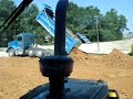 Quad Axle Kenworth Dumping  Dirt