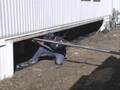 Blowing Insulation Into a Mobile Home Belly