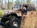 bad ass  HUGE  jeep in the mud boggin. 4x4