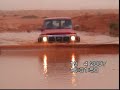 Nissan 1994 4x4 moving in the water in tharmada village in the middel of the desart
