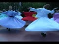the mevlevi lodge of dervishes in istanbul performing the whirling meditation called sema. the fellow who stands on stage and does not move is the master.