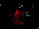 host of the parkdale revue open stage at mitzi's sister, toronto, on, jimmy byron, performs an improvised version of his original number, 