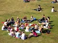 the two text blurbs in norwegian says:

-25 cute girls in a heart shaped ring on the grass of solsiden, here's the dominator needed! (solsiden is a crowded cafe/restaurant location in trondheim)

-