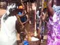 Communal pounding of casava and Yam to produce Ghanaian dish of Fufu