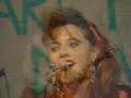 candye kane on the memorable rockabilly bandstand, santa monica, 3-15-89. jerry sikorski on guitar, then-hubby thom yearsley on bass.