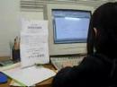 A little girl is typing Japanese sentences.