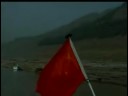This footage, taken in 2002, shows towns and cities that were at the time slated for demolition and are now flooded by the Three Gorges Dam. There is footage of actual demolition of some towns, and of construction on the dam itself.