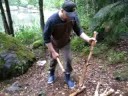 cutting wood with little axe,,, in a rainy day,