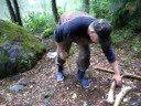 cutting wood with little axe,,, in a rainy day,