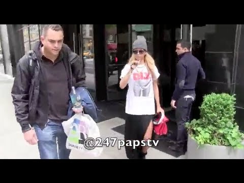 nyc - Rihanna leaving her hotel and arriving at her film set where she was filming a Bud Weiser Commercial in Midtown nyc , she was rocking long blonde hair as sh...