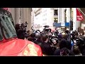 Protesters march on New York Stock Exchange on two-month anniversary of Occupy Wall Street. Outnumbered police are surrounded. Motorcycle cops retreat with nowhere else to go. We have you surrounded at www.michaelmoore.com