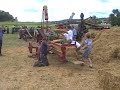 Baling Straw with 12 Horsepower Fuller & Johnson Engine Baling Straw with 12 Horsepower Fuller & Johnson Engine