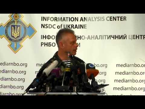 center - Col. Andriy Lysenko, Ukrainian National Security and Defense Council information center spokesman.
