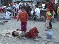 Young street acrobats at a market in Dali China