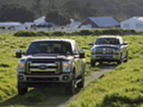 ford - We pit the all new 2011 Ford Super Duty against our reigning Truck of the Year, the 2010 Ram Heavy Duty to figure out which one is truly the king of the heav...