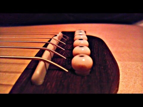 how to adjust acoustic guitar string height