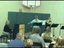 Mary Anne and Laura play flute and Elsa sings in church
