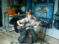 eight year old Robin plays the guitar