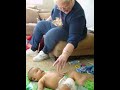 Great-grandma El Fattal playing with Raiden when she first met him.