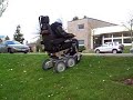 iBOT� Mobility System Going Up Curb and Across Grass Hill