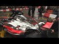 Jenson Button drives a Vodafone McLaren Mercedes F1 car through Manchester