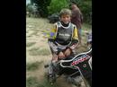 a collection of 125cc and 350cc speedway photos featuring 13 year old nick morris