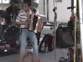 briggs brown, a young accordion wiz, sits in with steve riley and the mamou playboys at the 2008 eunice mardis gras celebration. this song's called the back door