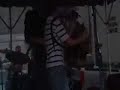 briggs brown, a young accordion wiz, sits in with steve riley and the mamou playboys at the 2008 eunice mardis gras celebration. this song's called the back door