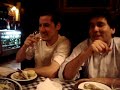 Sopaipillas remojadas en jugo de machas a la parmesana